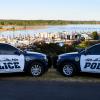 Two St. Helens patrol vehicles with St. Helens riverfront in background