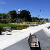 Phase One Riverwalk Project complete with view looking down new walking path with bench in foreground