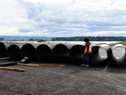 New polymer-coated corrugated steel pipe sections 