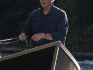 Author Warren C. Easley in a boat fishing
