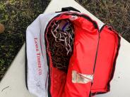 Land and Timber red bag with chains inside 