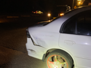 Side rear of unidentified vehicle with red painted tire spokes and rim 