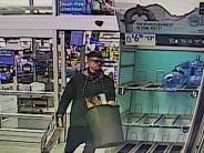 Male suspect one carrying trash can with merchandise out of Walmart 