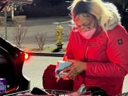 Walmart theft suspect wearing glasses and mask near vehicle 