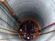 The concrete floor is poured. Now the "jacking" installed tool to push the pipes out into the aquifer