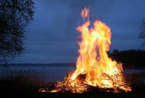 Burn pile on fire in evening 