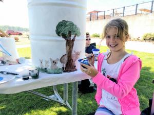 Participant painting can at the 2017 Trash Can Painting Competition 