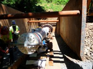 Construction workers in trench with new stormwater pipe at St. Helens project. 