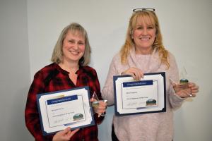 Court Clerk Melanie Payne and Public Works Office Assistant Sheri Ingram pose for a photo with employee of the year certificates