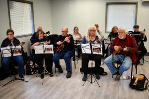 St. Helens Public Library Ukulele Orchestra playing instruments at Recreation Center
