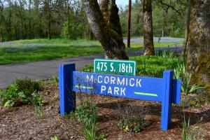 Painted park entrance sign with McCormick Park painted on it