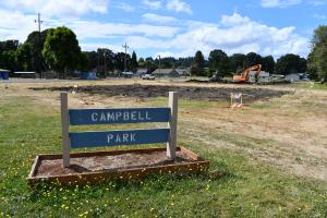 Campbell Park Sign with Sport Court Demolition Progress in Background