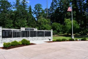 McCormick Park Veterans Memorial wall with soldier names and U.S. flag 