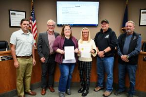 St. Helens City Council and Recreation Manager in Council Chambers holding Lights On proclamation