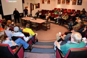 January First Thursday presentation with people seated in auditorium