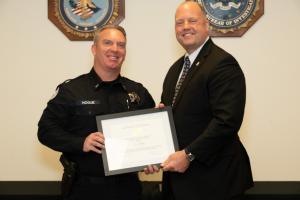 SAC Kieran Ramsey with St. Helens Police LT Joe Hogue displaying awards plaque 