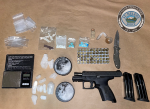 Items seized after Morton's arrest included a digital scale, a gun with ammunition, methamphetamine, and drug paraphernalia. 