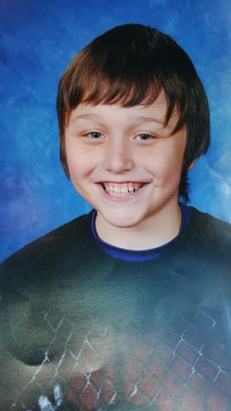 School picture of 13-year-old River Casino Elder smiling