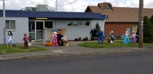 Officer Friendly and K9 Spike welcome "Trick-or-Treaters" at the St Helens Police Department