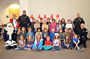 Third grade class photo with police officers 