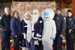 Donut Day picture with Officer Claus and police officers