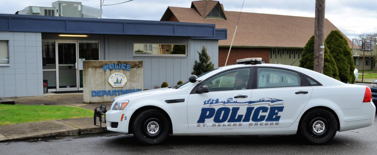 Front of St. Helens police station with old patrol car 