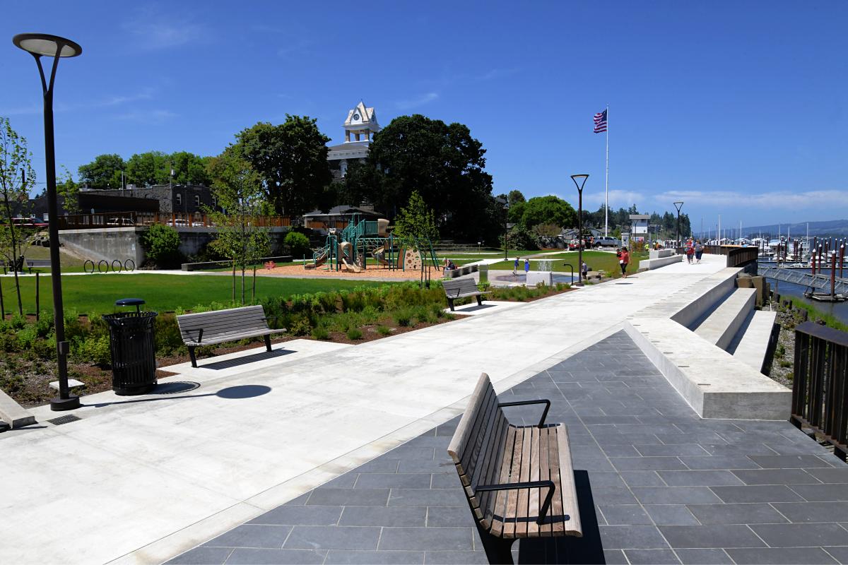 Phase One Riverwalk Project complete with view looking down new walking path with bench in foreground